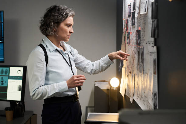 istock Investigating Crime Scene Evidence with Focus 2171060211