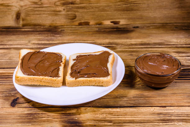 istock Two sandwiches with chocolate spread on a white plate 2171062939