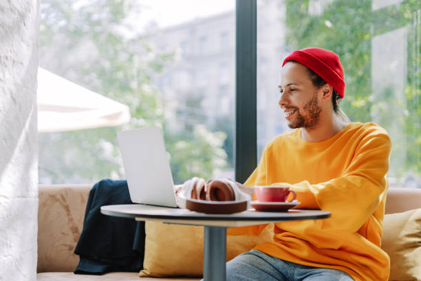 istock Happy freelancer working on laptop in cafe enjoying modern lifestyle 2171063723