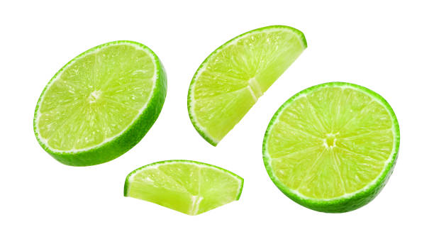 istock Flying slices green lime collection isolated on white background. 2171068635