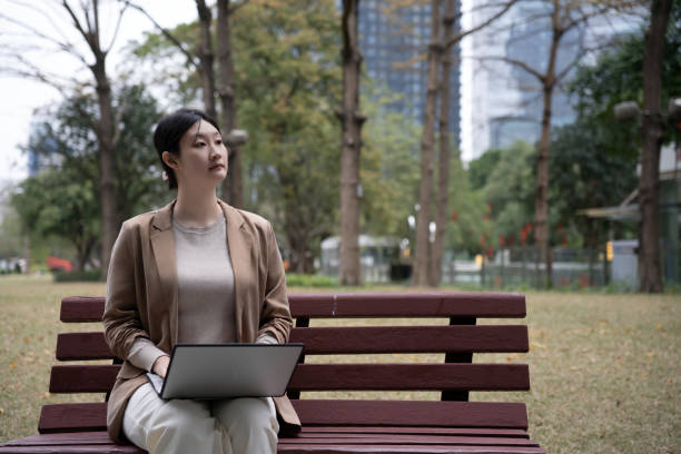 istock Reflective Outdoor Workspace: A Modern Professional in Nature 2171070583