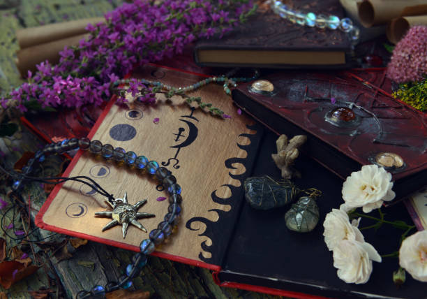 istock Mystic still life with magic book of spells, crystals and witchy ritual objects on old table. Occult, esoteric, wicca and divination concept. No foreign language, all symbols are fictional 2171072873