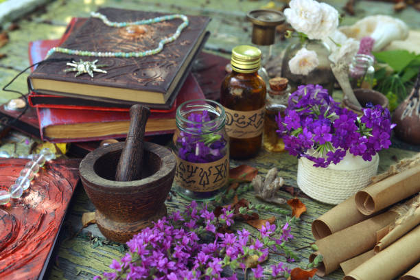 istock Mystic still life with witchy bottles, magic books of spells and ritual objects on old table. Occult, esoteric, wicca and divination concept. No foreign language, all symbols are fictional 2171072979