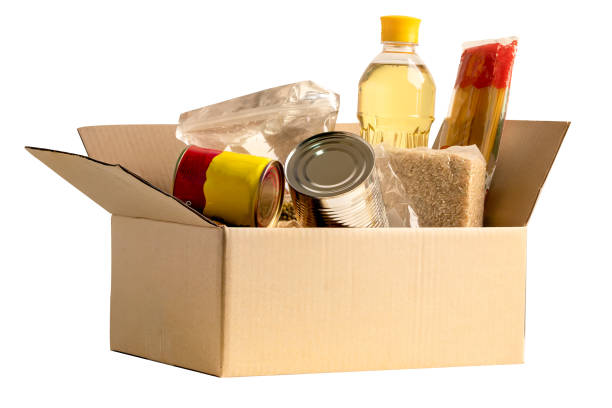 istock Foodstuff for donation isolated on white background with clipping path, storage and delivery. Various food, pasta, cooking oil and canned food in cardboard box. 2171073946