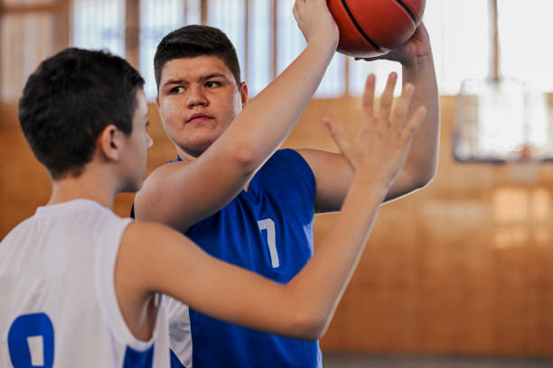 istock Young basketball athlete practicing a shot 2171076968