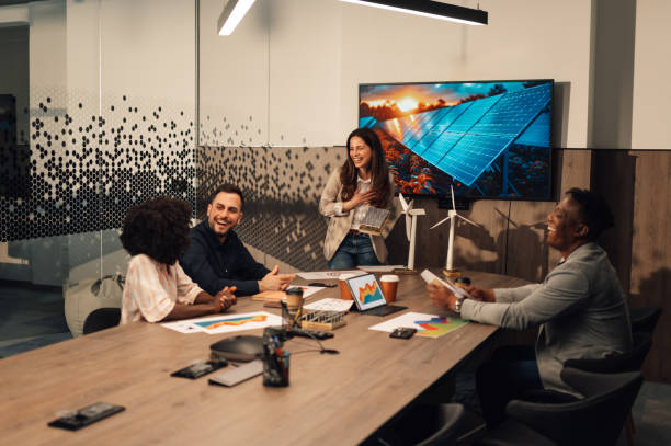 istock Innovative businesswoman presenting solar panels model to diverse experts 2171077007