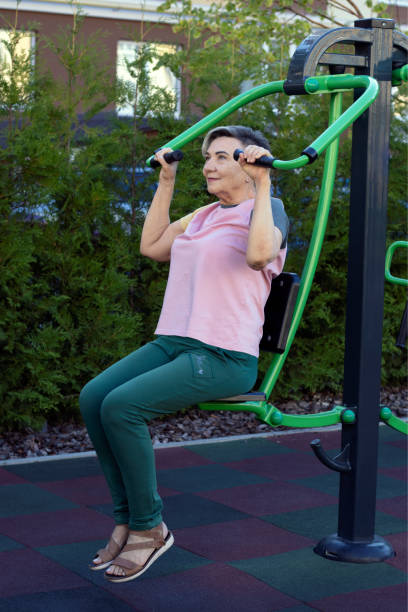 istock Senior woman doing exercises on a street machine. 2171081647