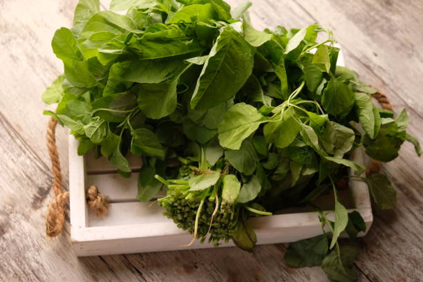 istock Spinach (Amaranthus) is a plant that is commonly grown for its leaves as a green vegetable. spinach on a white wooden tray. 2171084618