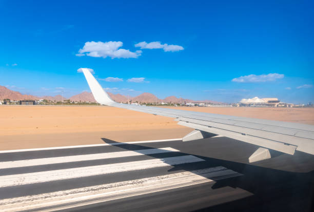 View from the airplane window during takeoff in Sharm el-Sheikh, Egypt. View from the airplane to desert mountains