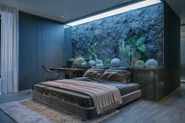 istock Modern bedroom with a blue aesthetic theme, dark gray bed, textured wall, and plants. 2171088070