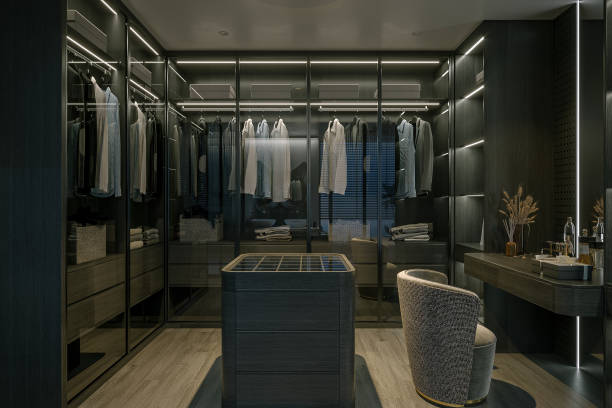 istock Vanity Area A luxury walk-in closet with clothes hanging on racks. 2171088157
