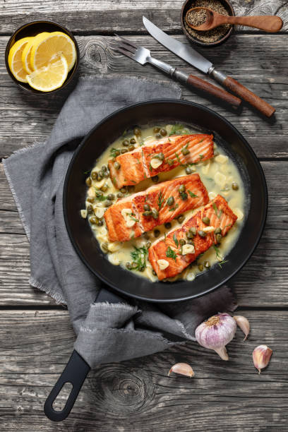 istock salmon piccata with lemon caper sauce in a pan 2171089110