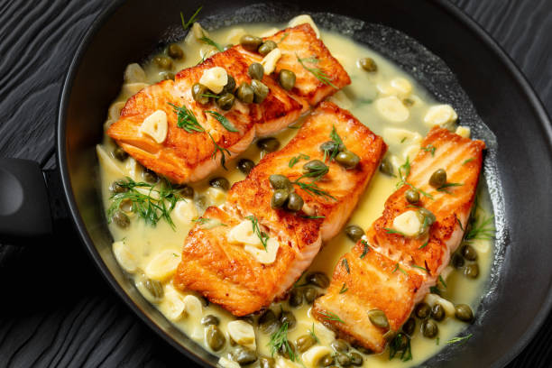 istock salmon piccata with lemon caper sauce in a pan 2171089112