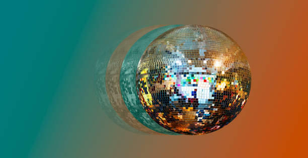 istock Party disco mirror ball reflecting orange and green lights 2171090623