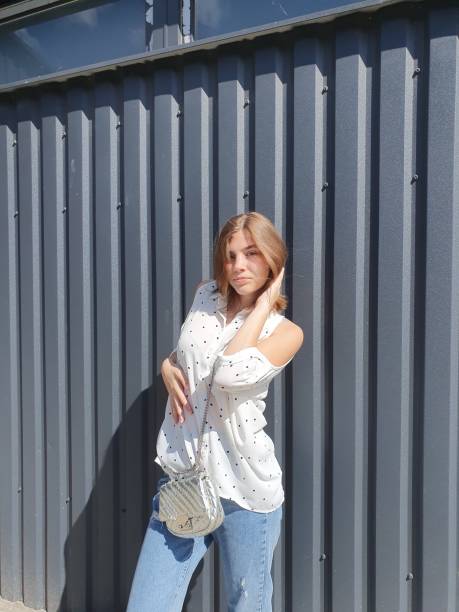 istock Girl on white shirt on sunny day 2171091085