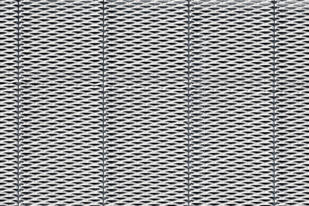 The white surface of the household storage container made of plastic has a structure similar to the wicker wall of a basket. Background.