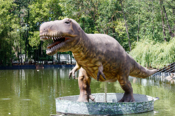 istock Dinosaur sculpture on the lake in the park 2171095603