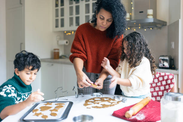 istock Family Baking Christmas Cookies in Cozy Kitchen 2171096549