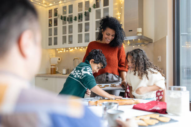 istock Family Baking Cookies in Cozy Modern Kitchen 2171096559