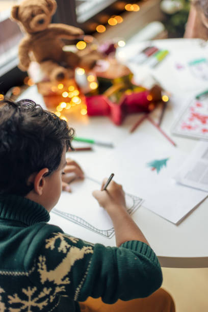 istock Child Drawing Christmas Cards at Home 2171096620