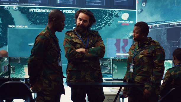 istock Diverse army officers examining real time data on a hologram 2171097147