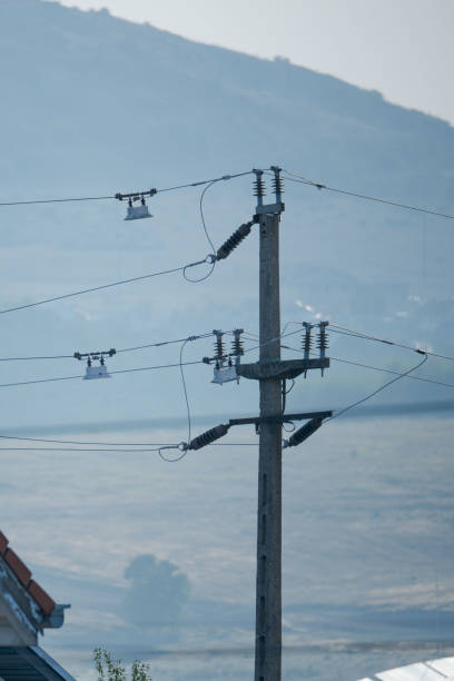 istock Electrical transmission tower on street 2171097324