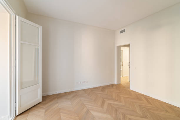 istock This is a spacious minimalist room featuring elegant herringbone flooring that impresses 2171098569