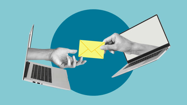 istock Message on a computer concept. Hand with a letter from a laptop and hand reaching for the letter. Writing and sending email 2171098959