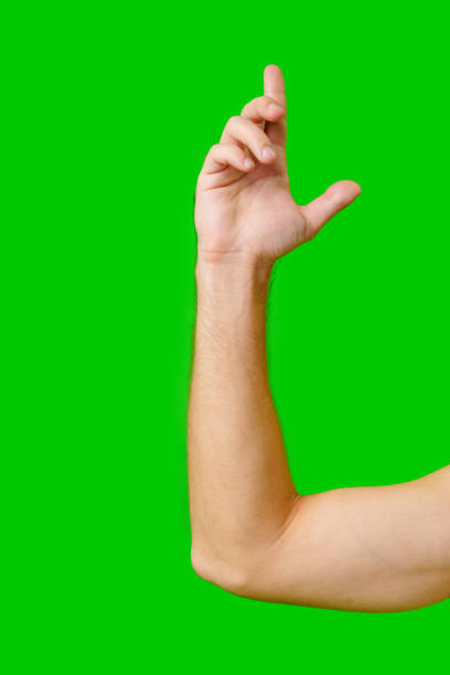istock Hand Gesture Above Arm Against Bright Green Background 2171099533