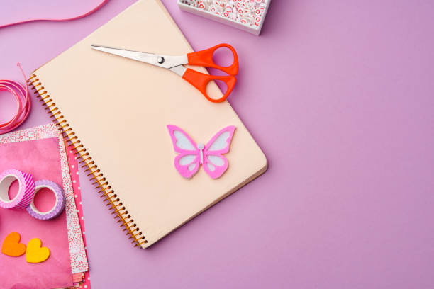 istock Crafting supplies on a purple background ready for creative projects 2171099637