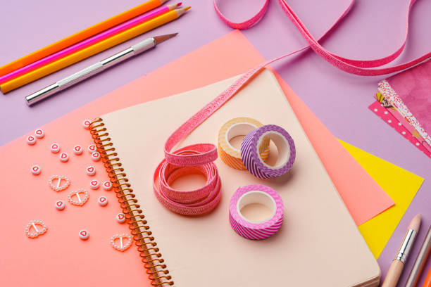 istock Crafting supplies on a purple background ready for creative projects 2171099652