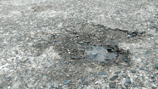 istock Transport infrastructure with an unrepaired road with a pothole 2171099718
