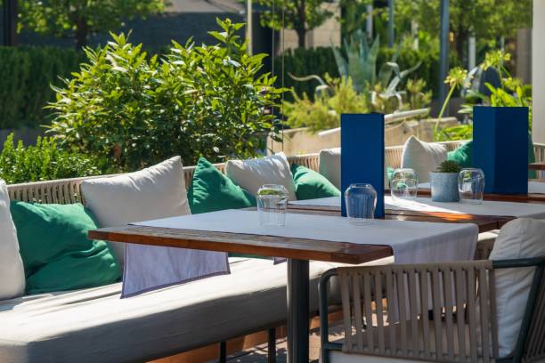 istock Outdoor restaurant seating with cushioned benches 2171100463