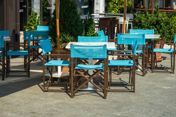 istock Outdoor cafe seating with bright blue chairs 2171100490