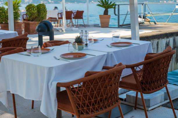 istock Seaside restaurant with elegant outdoor dining setup 2171100747