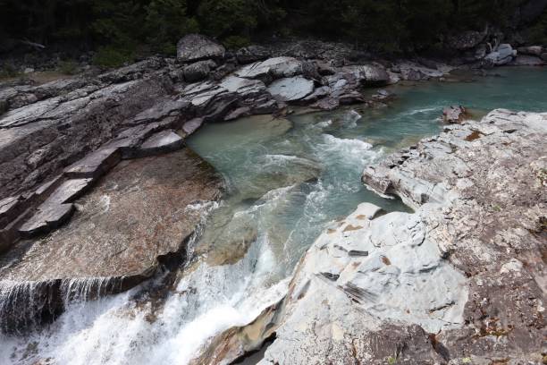 istock River flowing through rocky terrain in nature. 2171101518