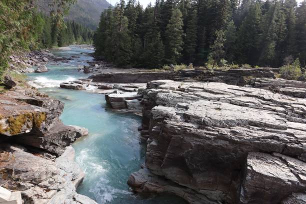 istock Turquoise River Flowing Through Rocky Terrain 2171101566