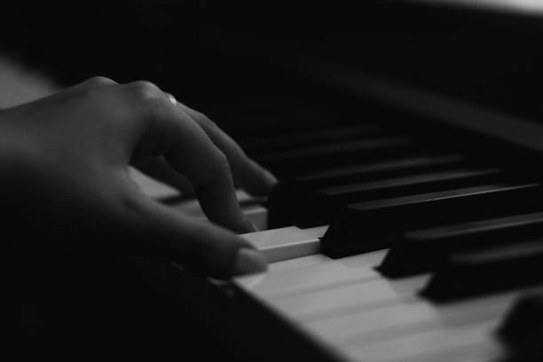 istock Piano keys person plays classical music black and white 2171102821