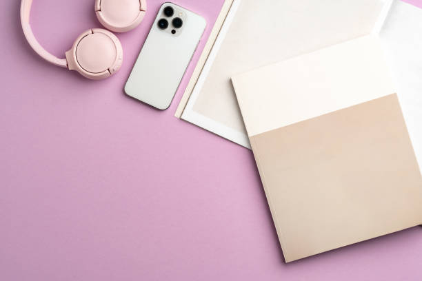 istock Colorful accessories and a smartphone arranged stylishly on a pastel pink surface 2171102905