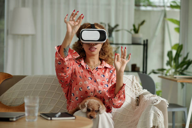istock Woman Playing Video Game In VR Glasses 2171103079