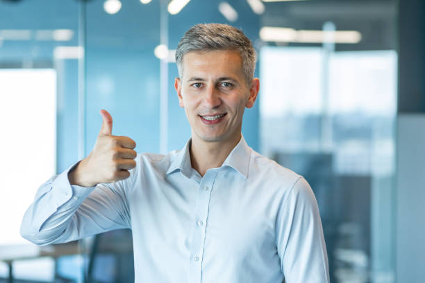 istock Confident Businessman Giving Thumbs Up 2171103545