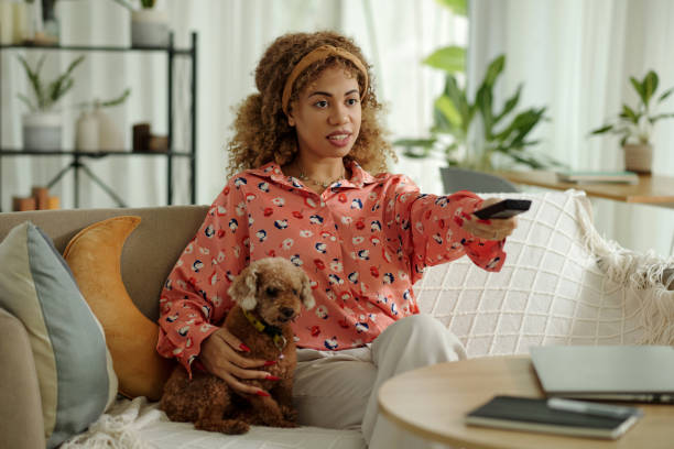 istock Woman Watching TV At Home 2171105472
