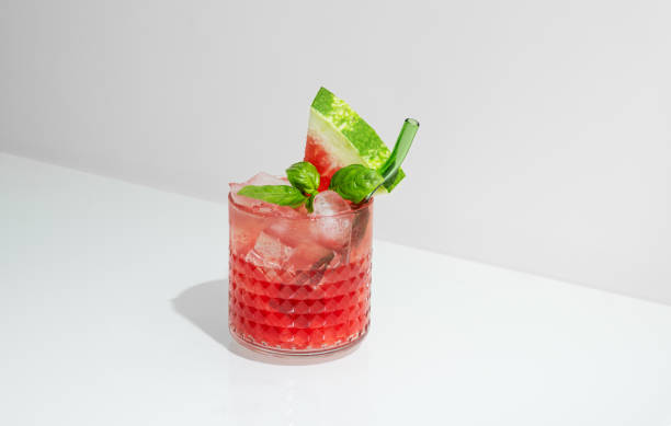 istock Glass of refreshing watermelon smoothie with basil, ice on white background with shadow. 2171106678