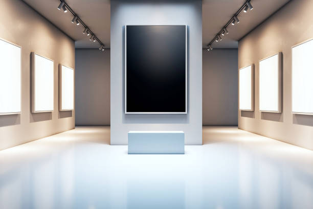 A room at a modern museum displays a number of white photo frames.