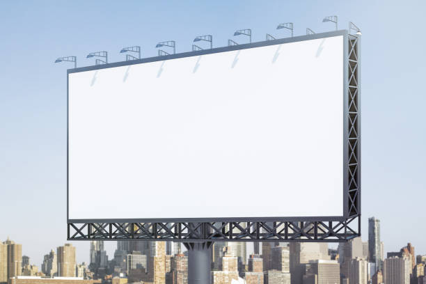 istock Blank white horizontal billboard on skyline background at daytime, perspective view. Mock up, advertising concept 2171107994