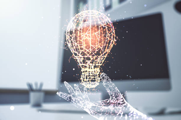 istock Double exposure of creative light bulb hologram and modern desktop with laptop on background, research and development concept 2171108059