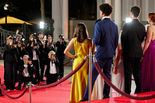 istock Male and female celebrities posing as a group on red carpet 2171108856