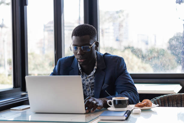 istock Black man working on laptop in cafe 2171110734