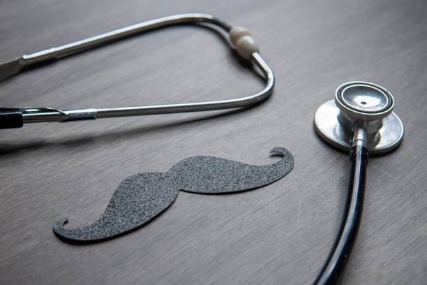 istock A stethoscope and a mustache cutout placed on a wooden table. 2171112153