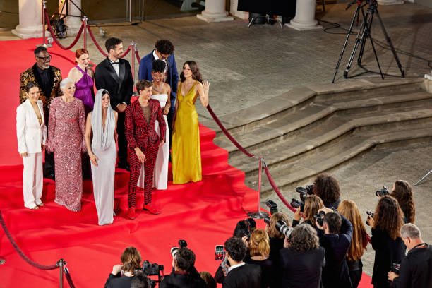 istock Celebrities posing for press photos at red carpet event 2171113354